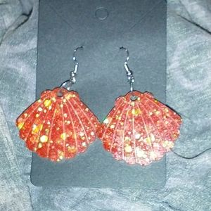 Shell shaped red glitter earrings
